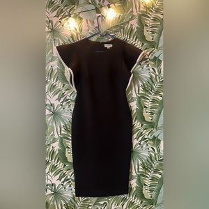 Calvin Klein black dress with white trim on the sleeves